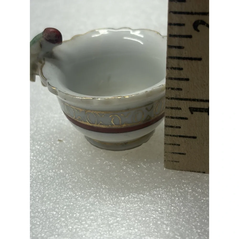 Vintage porcelain child's teacup with parrot bird handle Japan